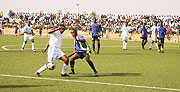 Amavubiu2019s Albert Ngabo is kept at bay a Tanzania defender in yesterdayu2019s match. The Rayon Sport midfielder was a disppointment as was the entire Rwanda team. (Photo / F. Goodman)