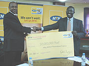 Ferwafa boss Jean Bosco (L) and MTN Chief Operating Officer Andrew Rugege after signing a Rwf50M sponsorship deal for Peace Cup back in April. The two partners are in talks to have MTN sponsor the league.