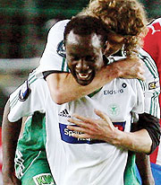 Olivier Karekezi  celebrates with a teammate after scoring for Ham Kam last season.
