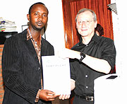 Vincent Mashami being awarded a Class B coaching license by the Germany Embassy deputy head of mission Frank Maier on Tuesday. (file photo)