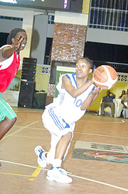 Rwandau2019s top female basketball players Honore Ayebare does her tricks against Burundi during the Zone 5 championship early this year. The national team has started early preparations for the continental event.