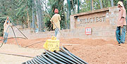 Digging trenches for fibre optic cables in Rwanda