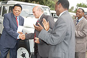 EAC Secretary General Juma Mwapachu receives the vehicles from Suresh Nathwani, the branch manager of CMC Automobiles in Arusha yesterday. (Courtsey Photo)
