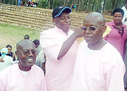 L-R Vincent Ngarambe , Jean Nkundiye, and Augustine Hategeka, celebrate after being cleared of Genocide charges. (Photo: D. Sabiiti)