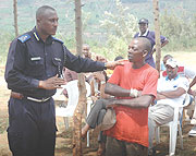 Supt. Emmanuel Butera in charge of Community Policing explains to the locals of Mbandazi cell, Rusororo Sector on the dangers of drug abuse, yesterday. (Photo/ F.Goodman)