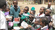 St Kizito Primary School pupils asking for second helpings of food