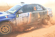 Costa Olivier rises dust in his Subaru Imprezza on day two of Zimbabwe challenge rally.