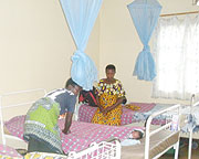 Maternity ward: A  mother covers her new born baby while an expectant mother looks on. (Photo / G. Anyango)  