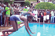 Agahozo Alphonsine (L) getting set for the  50m breast stroke final during the KCB sponsored competition held in Huye on Sunday.