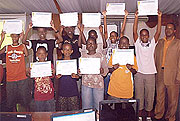 A group of Rwandan teens show their certificates after training on Visual Basic in Kigali recently. 