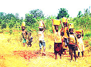 Rural children involved in domestic work during class hours.(Photo S/Rwembeho)