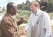 Ian Redmond (R) chats with Premier Bernard Makuza at this yearu2019s Kwita Izina ceremony in Kinigi