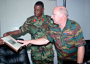 Rwandau2019s CDS Gen. James Kabarebe (L) admires a gift from his Belgian counterpart Gen. Charles Henri Delcour at the Ministry of Defence Yesterday. (Photo J Mbanda)