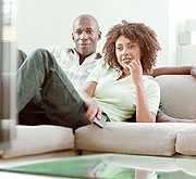 Watching TV. RTV, while attempting to have a more varied programme, still causes public complaints at times.