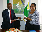 AfDB representative Diko Mukete (L) and NBI Executive Director, Henriette Ndombe after signing  two  Grants for Construction  of High KV Eletricity Project (Photo F Goodman)