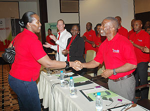 First Lady Jeannette Kagame greets Fr. Godfrey Nzamujo from Benin as she arrived at the Imbuto Foundation youth forum at Serena Hotel yesterday. (Photo J Mbanda)