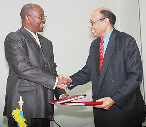 Finance Minister James Musoni and C.E.O Investment Climate Facility for Africa Omar Issa after signing. (Photo J Mbanda)
