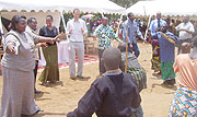 Some of the  marginalized residents of Ngondole and Kibali Cell celebrate the hand over of the donations in the company of guests at Ruhenda healt centre (Photo: A. Gahene)