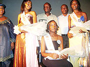 Miss UNATEK Mukazana, 1st and 2nd runner-ups pose for a photo with the VIP guests who included the Minister Joseph Habineza (standing behind the Miss).