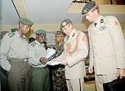 The visiting Dutch military delegation exchanging notes with their Rwandan counterparts at the Ministry of Justice yesterday. (Photo/ J Mbanda)