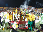 Atraco players parade the Kagame Cup trophy last season. The taxi-men side won a double including Cecafa and Peace Cup. They begin their title defence against second  division side Aspor.