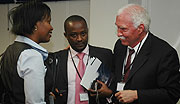 RDB officials Clare Akamanzi, Frank Twagira and Joe Ritchie during the launch of 2010 Doing Business Report. (File Photo)