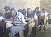 Teachers sitting for English examinations at Group Scholaire de Kibuye yesterday. (Photo: S. Nkurunziza)