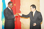 Prime Minister Bernard Mukuza and Ambassador Sun Shuzhong tossing to Chinau2019s 60th national day. (Photo F. Goodman )