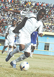 BACK WITH A BANG: Abbas Rassou protects the ball during a past encounter with Rayon Sport. Yesterday, the striker scored APRu2019s lone goal against Police to guide the club into the semi-final of the Pre-season tournament. (File Photo)