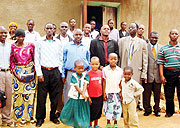 Pastor Emmanuel Rugazura and christians pose for a photo in Kayumbu, Kamonyi District. (Photo / D. Sabiiti)