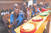 School feeding has improved the enrollment and retention of vulnerable children in Rwandau2019s primary schools. (Courtesy photo)
