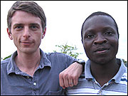 Bryan Mealer, left, with William Kamkwamba.