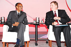 President Kagame shares a word with Jack Modzelewski, president and senior partner of Fleishman-Hillard at the summit yesterday. (Photo/ Lionel Gahima)