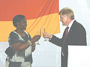 Foreign Affairs Minister, Rosemary Museminali and German Ambassador to Rwanda, Elmar Timpe, toast during the celebrations on Friday.