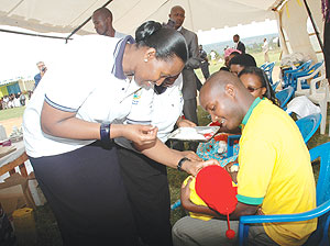 First Lady Jeannette Kagame administering a dose of Vitamin A to a child in Gashora as she launched the Immunisation Program yesterday. (Photo J Mbanda)