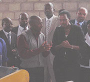 Andrew Rucyahana explains to the Infrastructure minister Linda Bihire during her visit to Haki Construction Company yesterday.