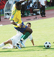 Abedi Makasi goes to the ground after being tripped by an Algerian player in the first leg which ended in a goalless draw. The striker has been ruled out of Sundayu2019s game after suffering a knee injury. (File Photo