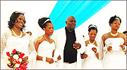 Milton Mbele and his four brides that he married on the same day.