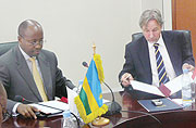 Finance Minister James Musoni and Dutch Ambassador Frans Makken during the signing yesterday (Photo G Majyambere)
