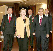 Secretary of State Hillary Clinton with President Abdullah Gul (right) and Foreign Minister Ali Babacan, left on March 7.