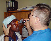 A German eye specialist examines a resident with eye defect at Ngarama Hospital in Gatsibo District early this year. (File photo)