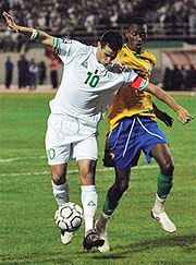 Rafik Saifi of Algeria controls the ball ahead of Jean Baptiste  Mugiraneza on Sunday. Inset Zambia head coach Herve Renard