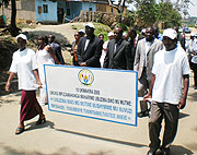Health Minister Dr Richard Sezibera and WHO representative Dr Jack Abdul lead residents in a march to mark the world mental Health day. (Photo/ S. Nkurunziza)