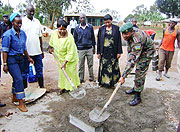 Women leaders being assisted by  other officials in brick making activities as part of the progarmme to mark  the Rural Womenu2019s Day celebrations. (Photo S Rwembeho)