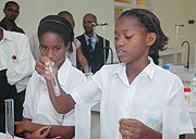 Students of Glory Secondary School making demos in the new school lab after it was opened yesterday. (Photo/ F Goodman)