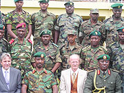 FROM LEFT: Frans Makken, Lt Gen Charles Kayonga and military officers pose for a group photo on the right is Maj. Gen Karenzi Karake. (Photo/ B. Mukombozi)