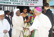 The Papal Nuncio to Rwanda, Bishop Ivo Scapolo talking to  the director of Cite Nazareth, Sister Dorocella Musabyemariya. (Photo D Sabiiti)