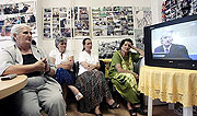 Watching the Radovan Karadzic trial on television in Belgrade, Serbia.