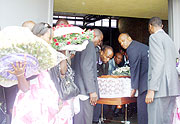 Family and friends carry the body of the Late Dr. Abedi Kizito Ruzigana. (Photo: D.Sabiiti)