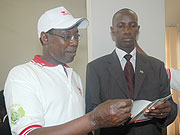 Dr Joseph Mucumbitsi the Chairman of Rwanda Heart Foundation (RHF) explains to MP Giovanni Renzaho about the foundation. 